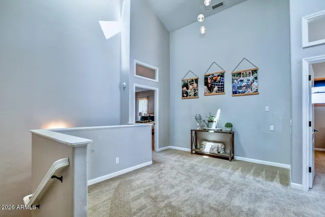 an aerial view of a house with swimming pool and mountain view