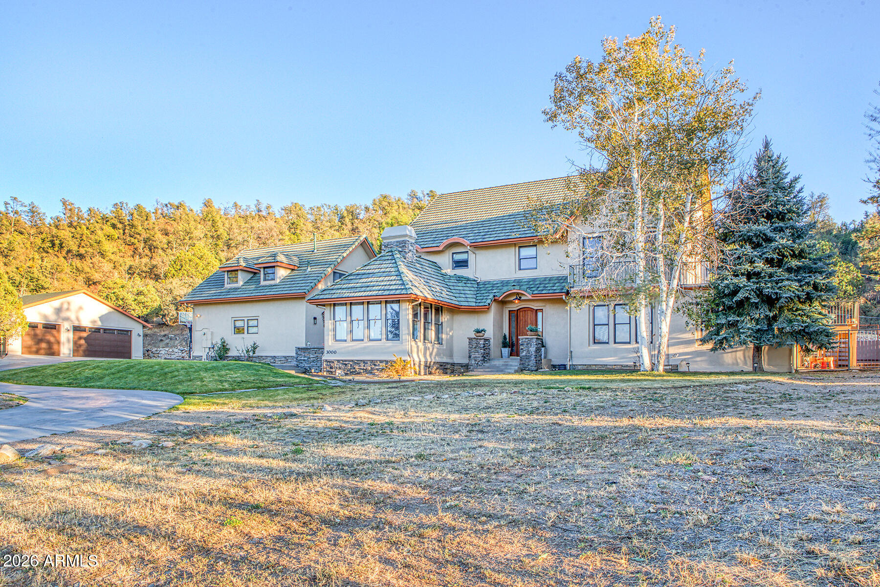 3000 Shadow Valley Ranch Road Prescott, AZ 86305 - Photo 4 of 70 a view of a house with a big yard and large trees