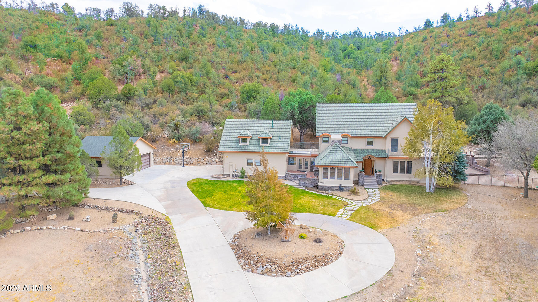 3000 Shadow Valley Ranch Road Prescott, AZ 86305 - Photo 62 of 70 an aerial view of a swimming pool with a yard and large trees