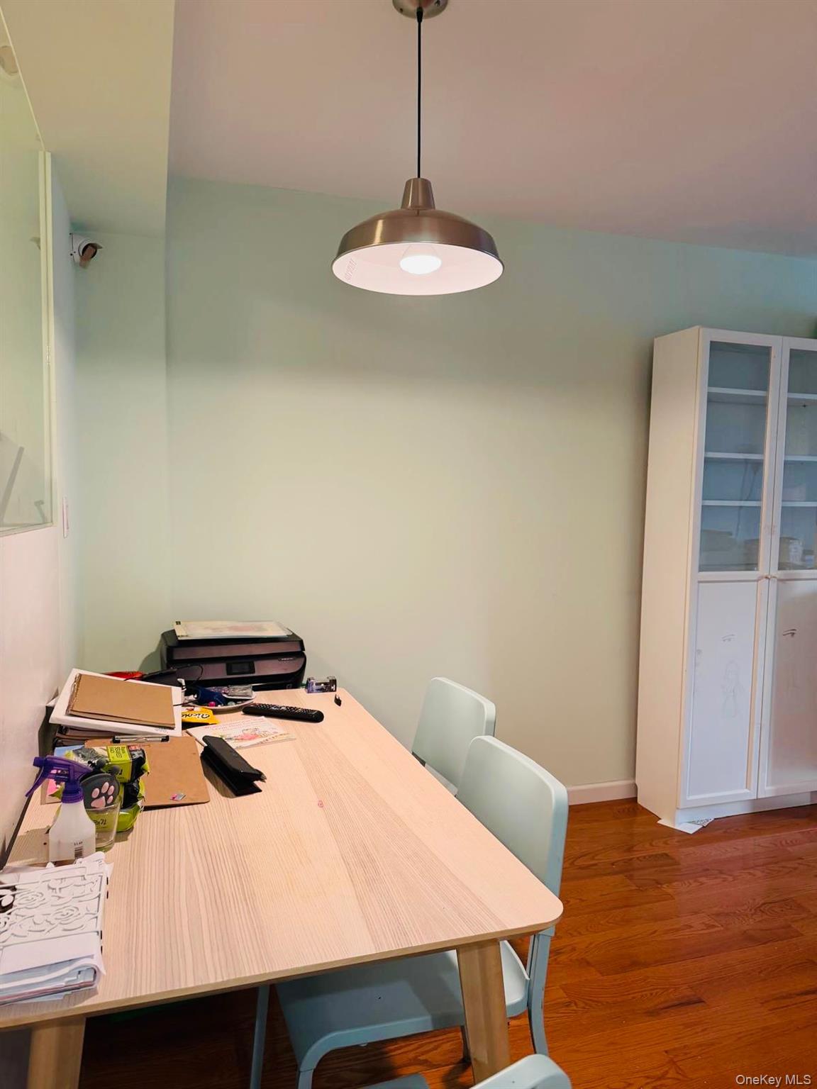 58-03 Calloway Street, Unit 6FF Queens, NY 11368 - Photo 2 of 6 Dining area featuring dark wood-style floors and baseboards