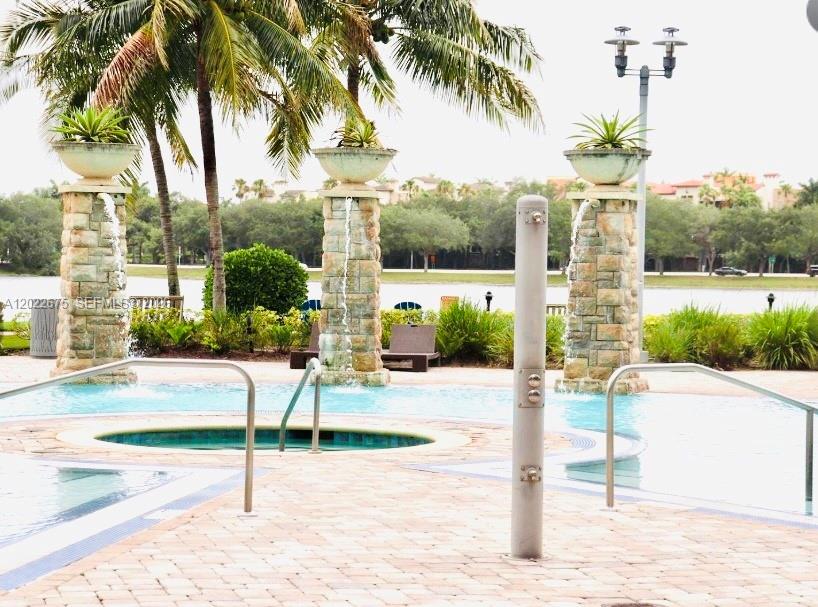 2681 North Flamingo Road, Unit 2602S Sunrise, FL 33323 - Photo 16 of 18 a house with a garden space