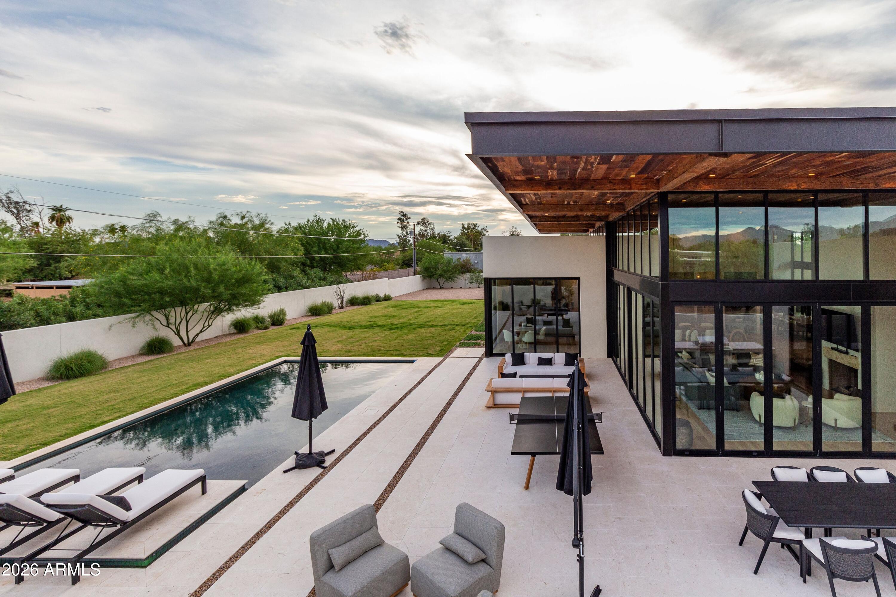 8307 East Gary Road Scottsdale, AZ 85260 - Photo 29 of 34 a view of a patio with chairs and a table