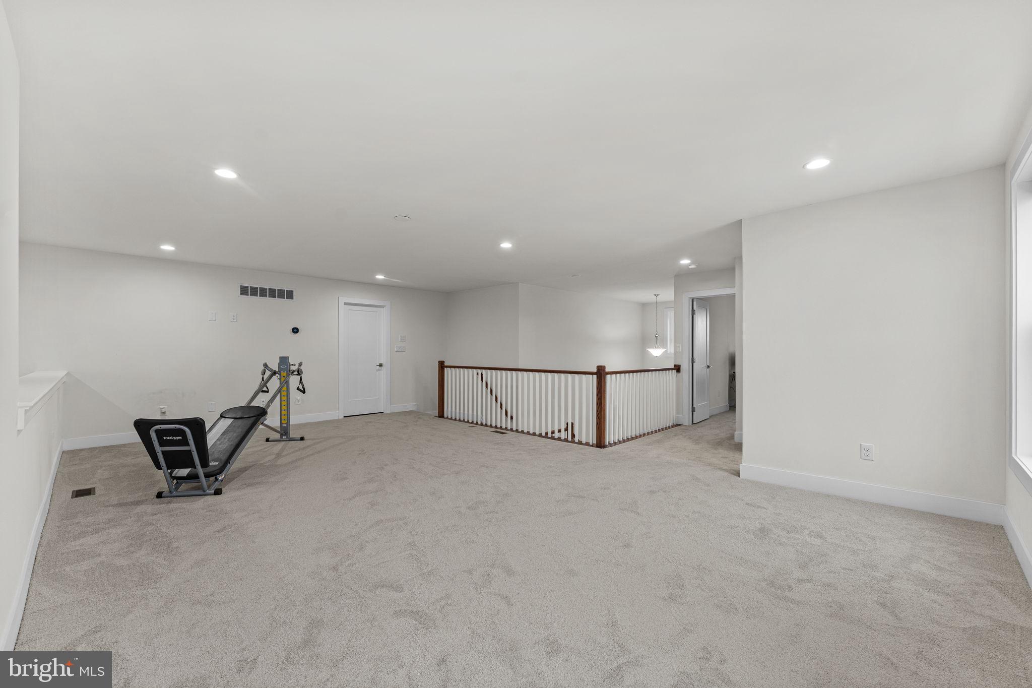 735 Appaloosa Road Downingtown, PA 19335 - Photo 27 of 35 an empty room with a table and white walls
