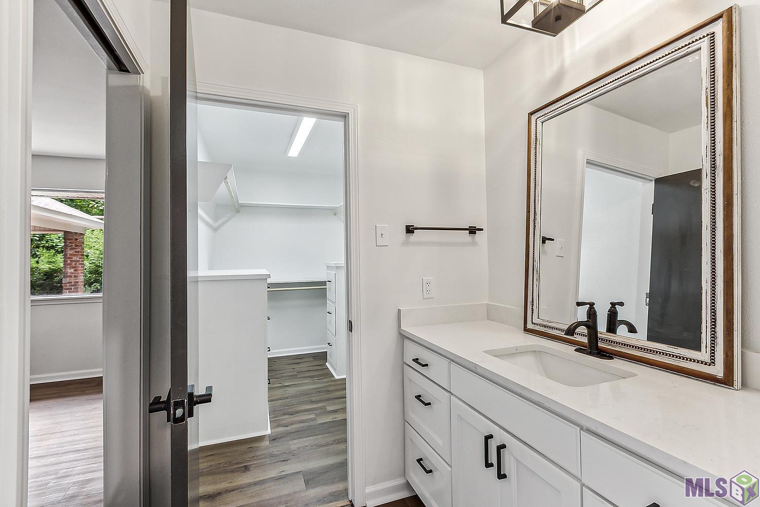 9736 Regency Drive Baton Rouge, LA 70815 - Photo 10 of 19 Main Bdrm closet & 1 of 2 vanities