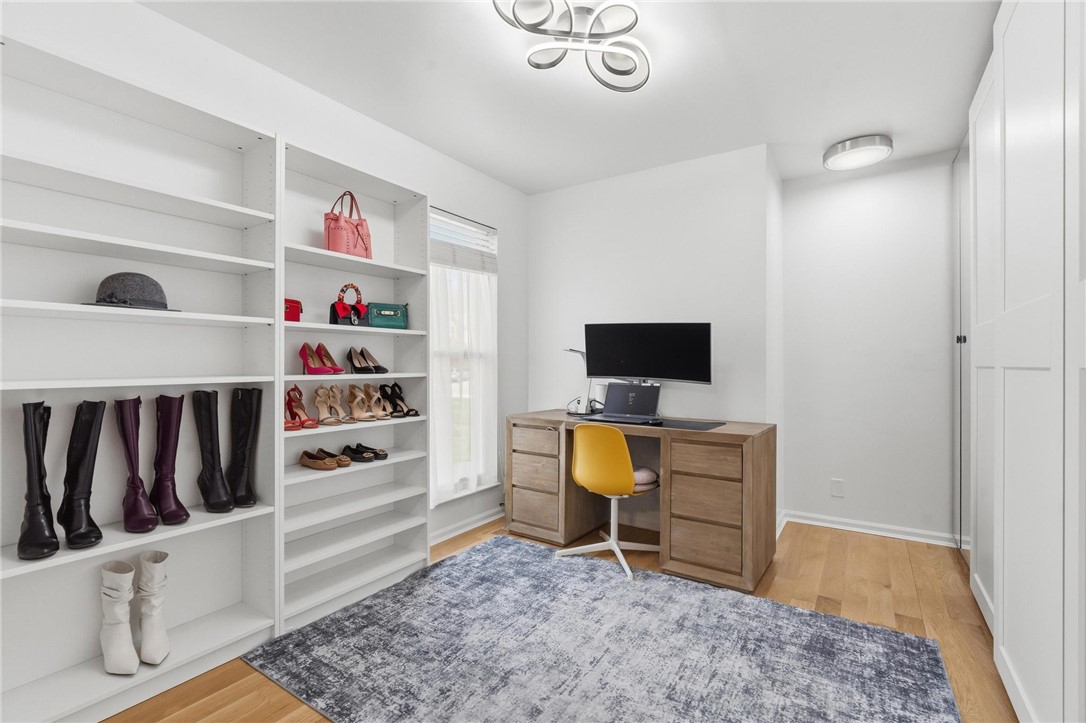 8781 Rupp Farm Drive West Chester, OH 45069 - Photo 32 of 48 A well-organized study with built-in shelving, hardwood flooring, and ample natural light.