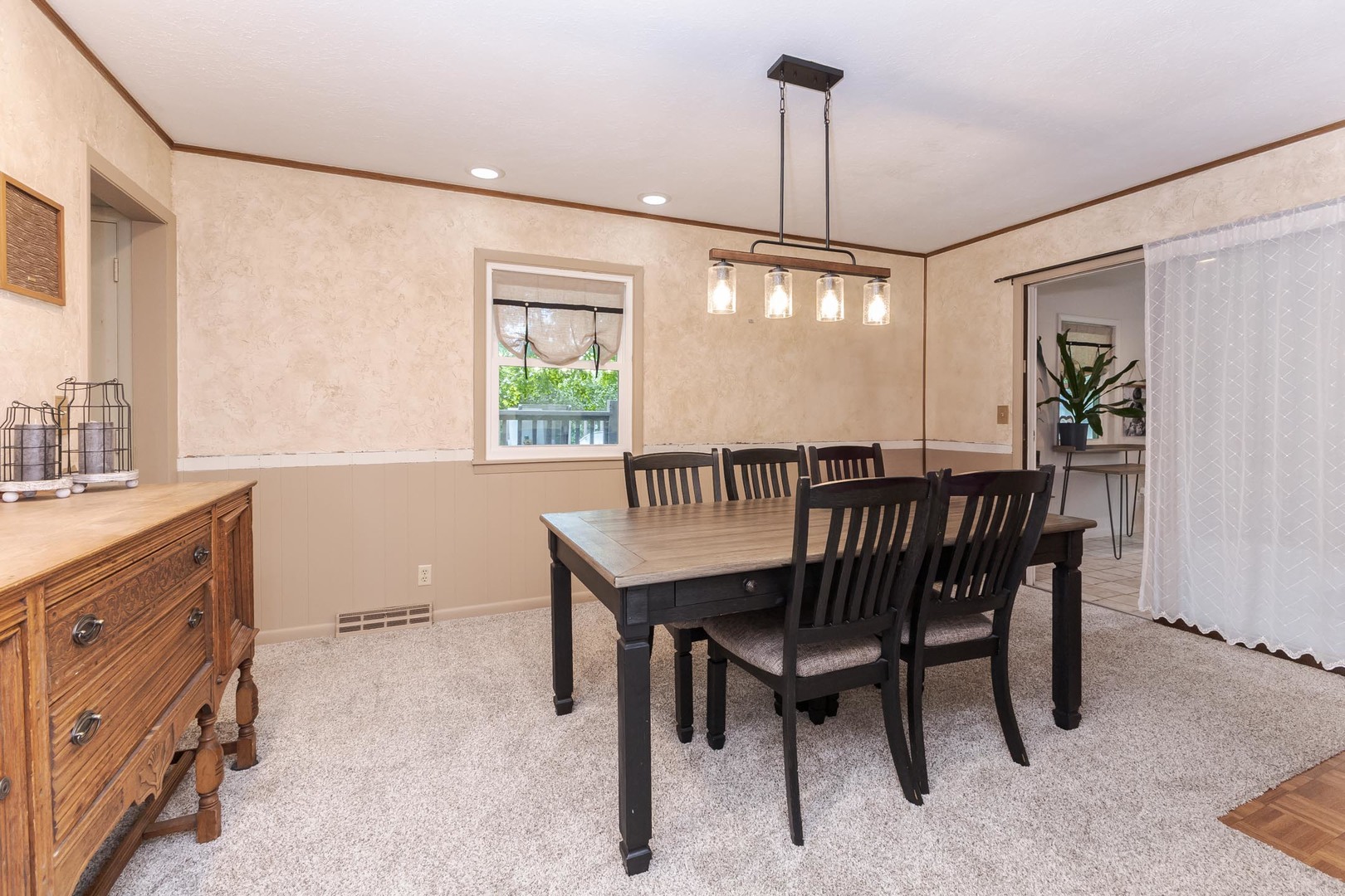 208 Foster Drive Normal, IL 61761 - Photo 12 of 32 a dining room with a wooden table and chairs