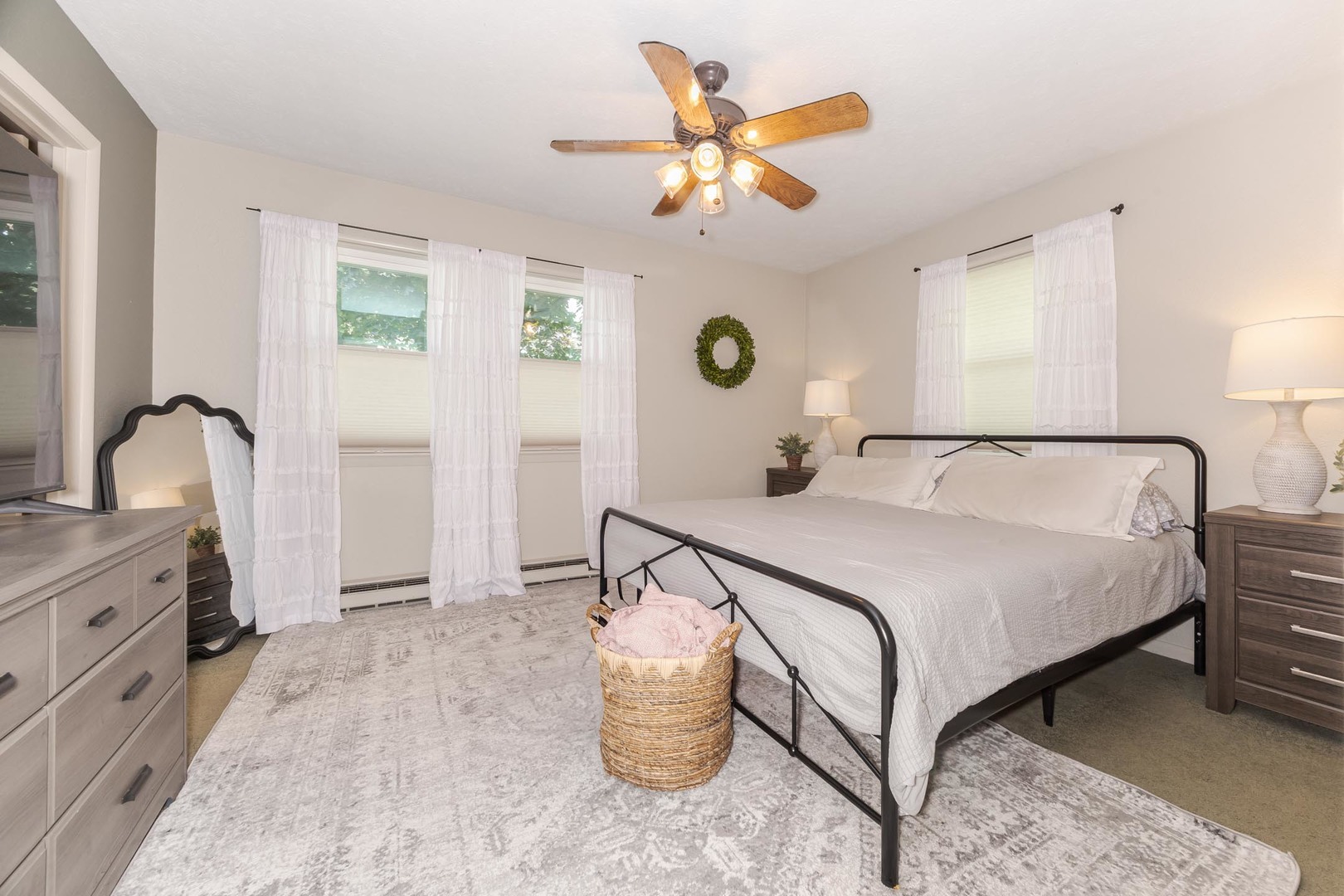 208 Foster Drive Normal, IL 61761 - Photo 16 of 32 a bedroom with a bed and a chandelier