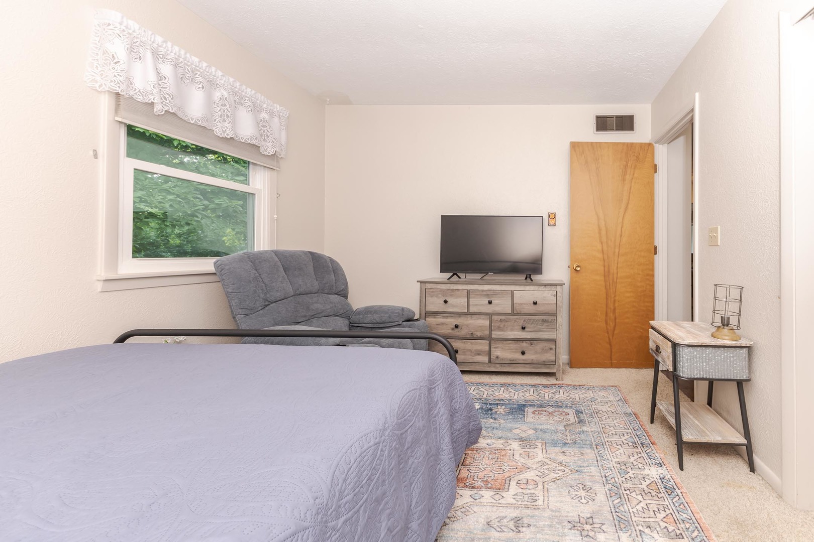 208 Foster Drive Normal, IL 61761 - Photo 21 of 32 a bedroom with a bed and a flat screen tv