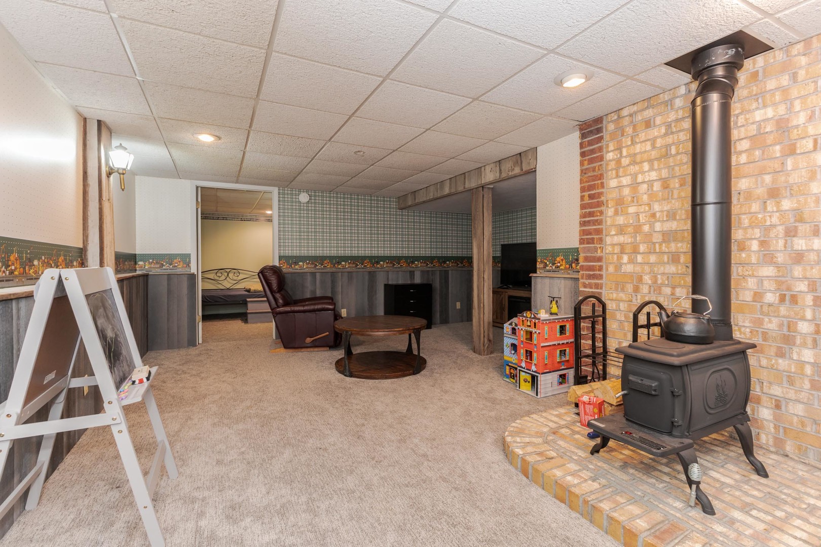 208 Foster Drive Normal, IL 61761 - Photo 22 of 32 a lobby with furniture and a flat screen tv