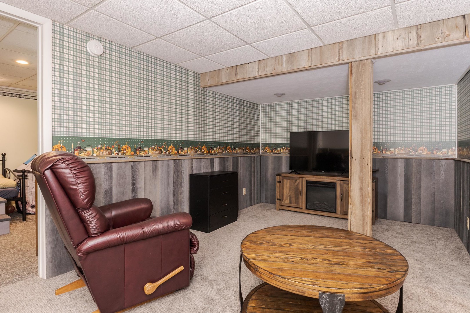 208 Foster Drive Normal, IL 61761 - Photo 24 of 32 a living room with furniture a flat screen tv and a fireplace