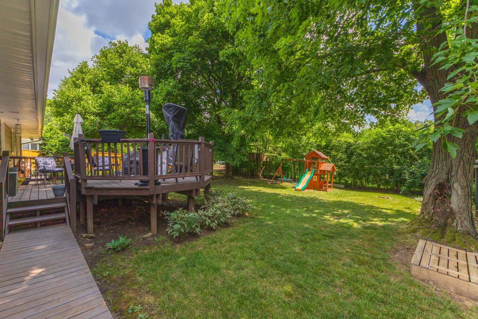 208 Foster Drive Normal, IL 61761 - Photo 29 of 32 a view of a table and chairs in the garden
