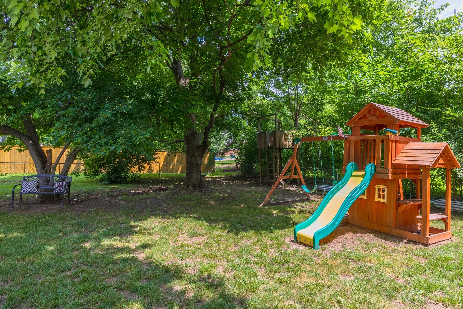 208 Foster Drive Normal, IL 61761 - Photo 30 of 32 a view of a backyard with a slide