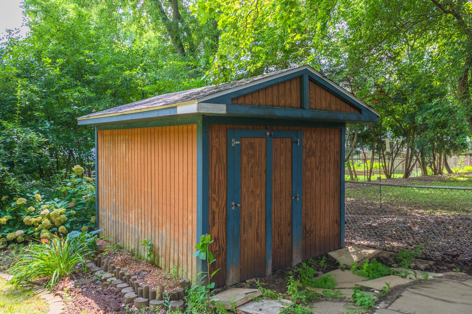 208 Foster Drive Normal, IL 61761 - Photo 31 of 32 a front view of a house with garden