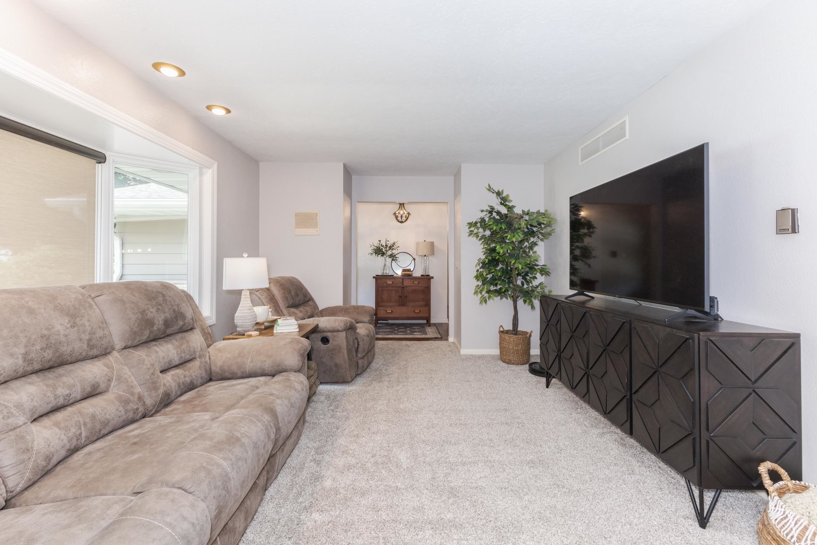 208 Foster Drive Normal, IL 61761 - Photo 5 of 32 a living room with furniture and a flat screen tv