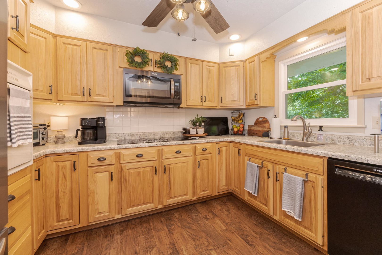 208 Foster Drive Normal, IL 61761 - Photo 7 of 32 a kitchen with stainless steel appliances granite countertop a sink a stove and cabinets