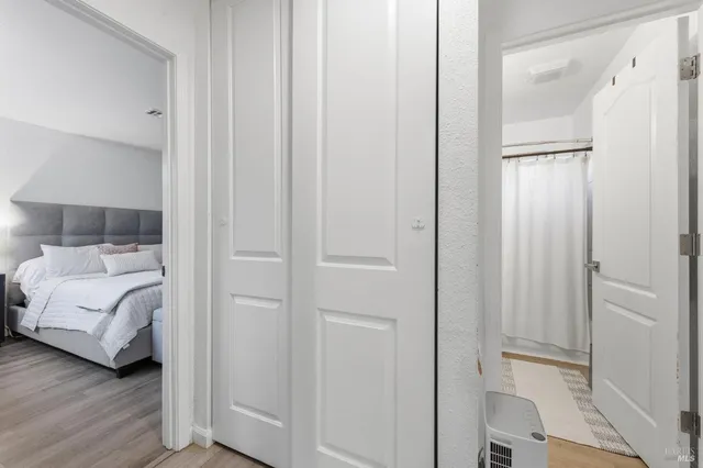 a bedroom with a bed and a mirror