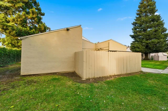 a view of a backyard with potted plants