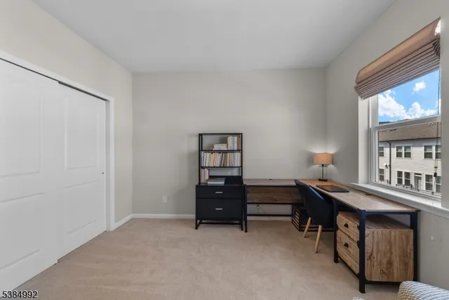 a view of a workspace with furniture