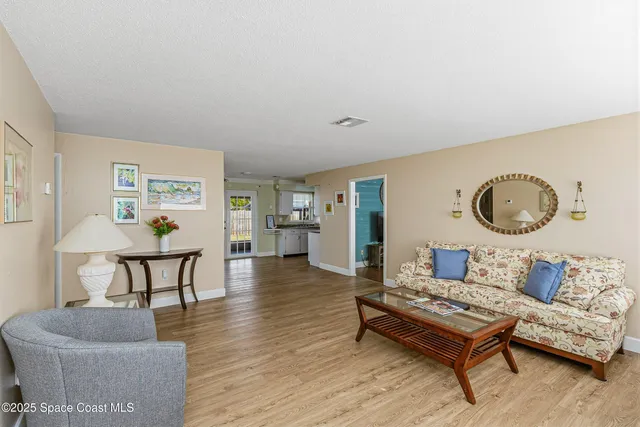 a view of kitchen living room with furniture and wooden floor