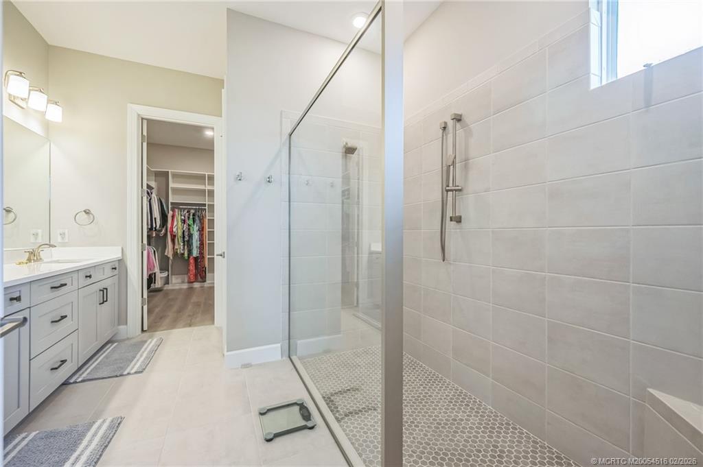 15111 Pescara Street Naples, FL 34114 - Photo 19 of 43 a bathroom with a shower and a sink