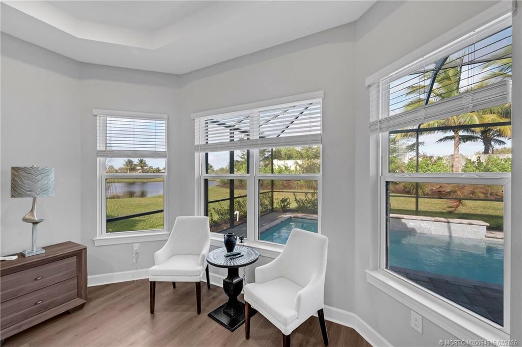 15111 Pescara Street Naples, FL 34114 - Photo 21 of 43 a living room with furniture and a window