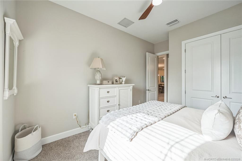 15111 Pescara Street Naples, FL 34114 - Photo 22 of 43 a bedroom with a bed and a window