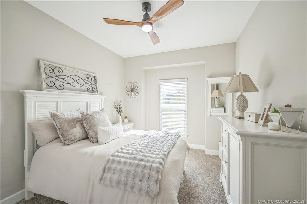 15111 Pescara Street Naples, FL 34114 - Photo 23 of 43 a bedroom with a bed and a window