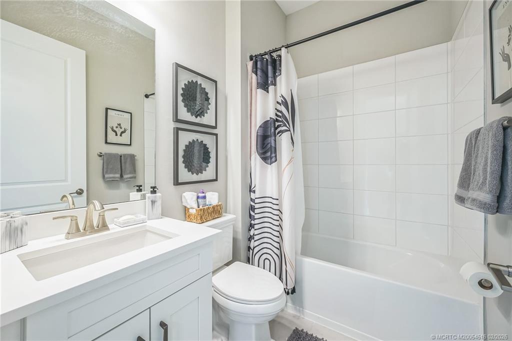 15111 Pescara Street Naples, FL 34114 - Photo 24 of 43 a bathroom with a sink toilet and shower