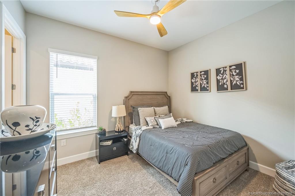 15111 Pescara Street Naples, FL 34114 - Photo 25 of 43 a bedroom with a bed and a window