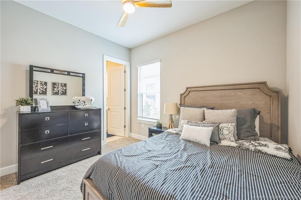 15111 Pescara Street Naples, FL 34114 - Photo 26 of 43 a bedroom with a bed and a dresser
