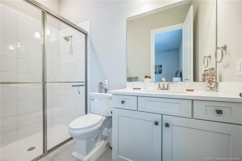 15111 Pescara Street Naples, FL 34114 - Photo 27 of 43 a bathroom with a sink toilet and shower
