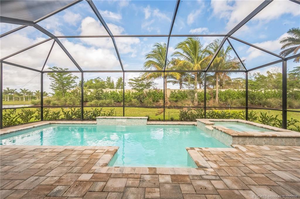 15111 Pescara Street Naples, FL 34114 - Photo 29 of 43 a view of swimming pool with a yard