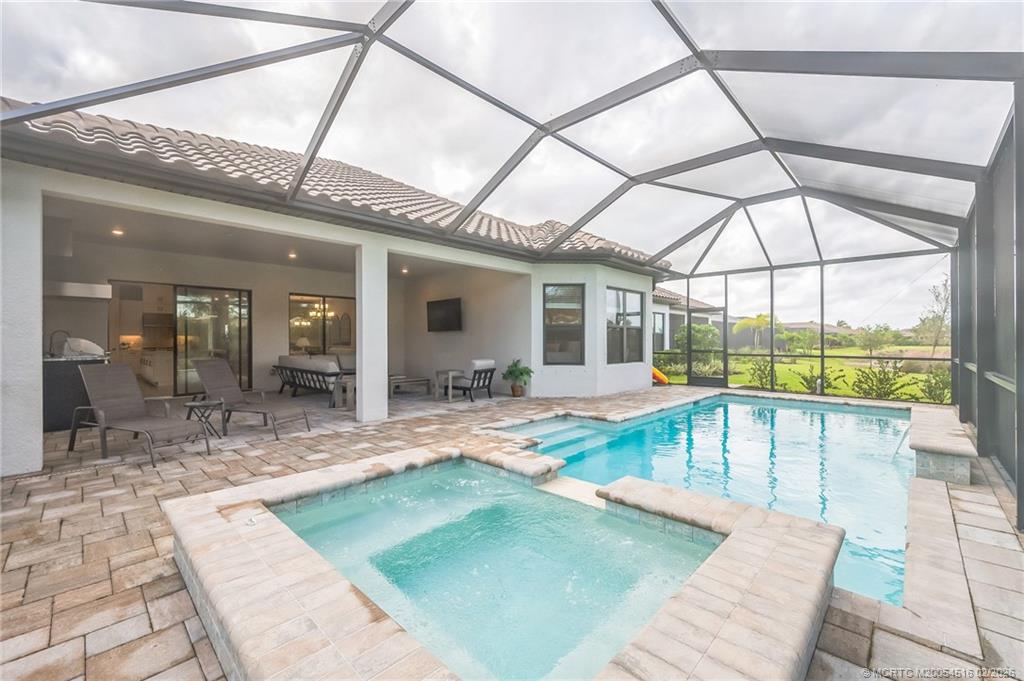 15111 Pescara Street Naples, FL 34114 - Photo 30 of 43 a view of a swimming pool with outdoor seating