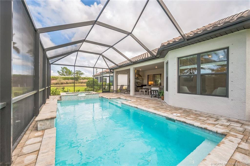 15111 Pescara Street Naples, FL 34114 - Photo 31 of 43 a view of swimming pool with outdoor seating