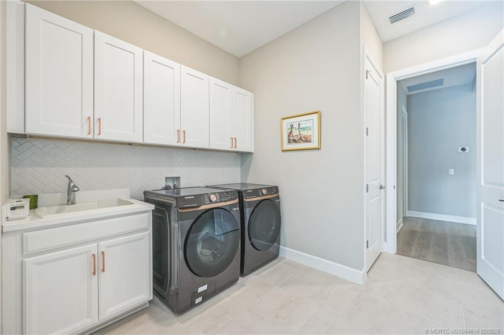 15111 Pescara Street Naples, FL 34114 - Photo 36 of 43 a utility room with sink dryer and washer
