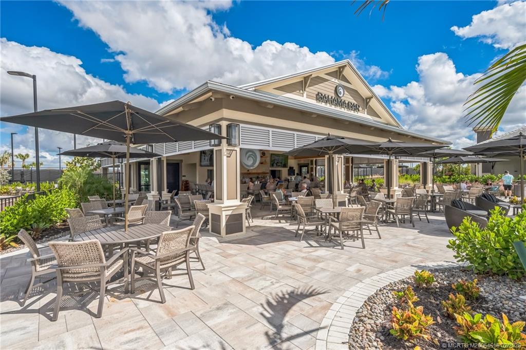 15111 Pescara Street Naples, FL 34114 - Photo 38 of 43 a view of a patio with table and chairs and potted plants