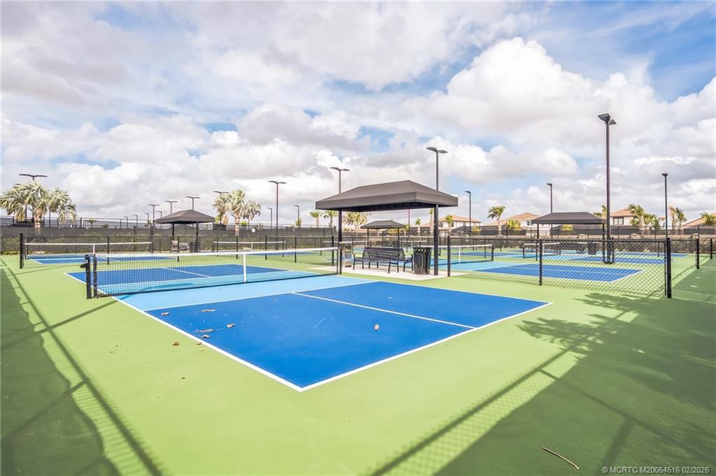 15111 Pescara Street Naples, FL 34114 - Photo 39 of 43 a view of a tennis court