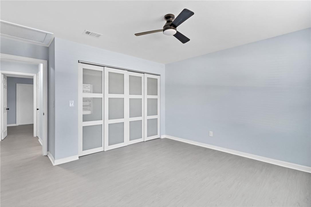 669 Vocelle Avenue Sebastian, FL 32958 - Photo 18 of 34 an empty room with a empty space and windows