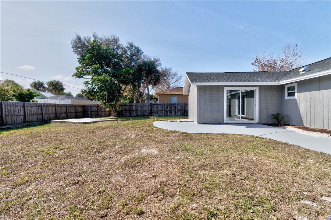 669 Vocelle Avenue Sebastian, FL 32958 - Photo 23 of 34 a view of a house with a yard and garage