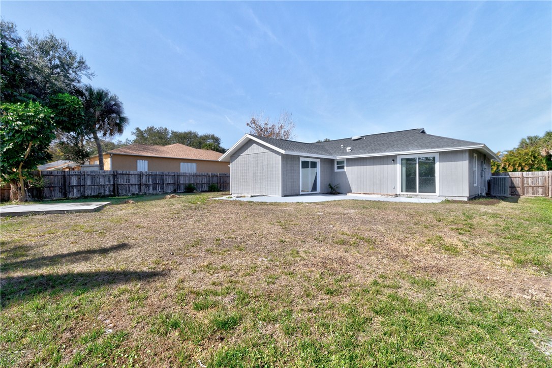 669 Vocelle Avenue Sebastian, FL 32958 - Photo 25 of 34 a front view of a house with a yard