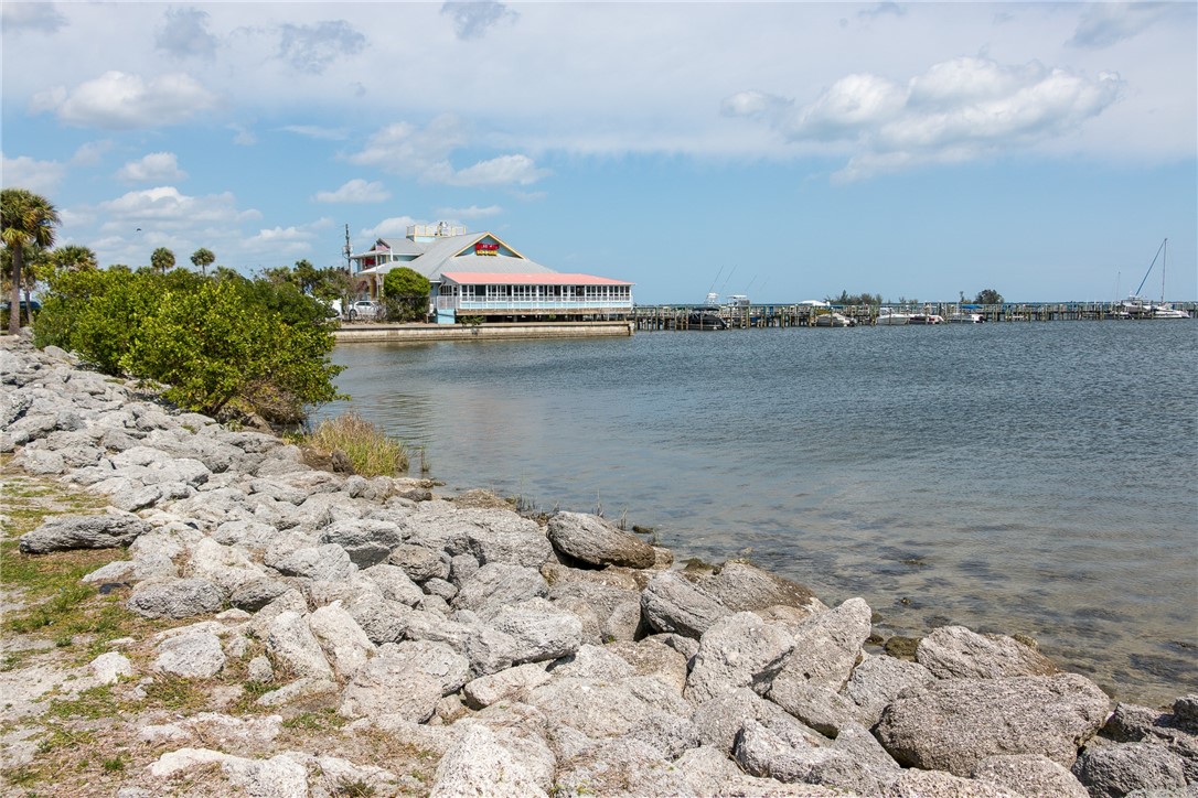 669 Vocelle Avenue Sebastian, FL 32958 - Photo 27 of 34 a view of a lake next to a building