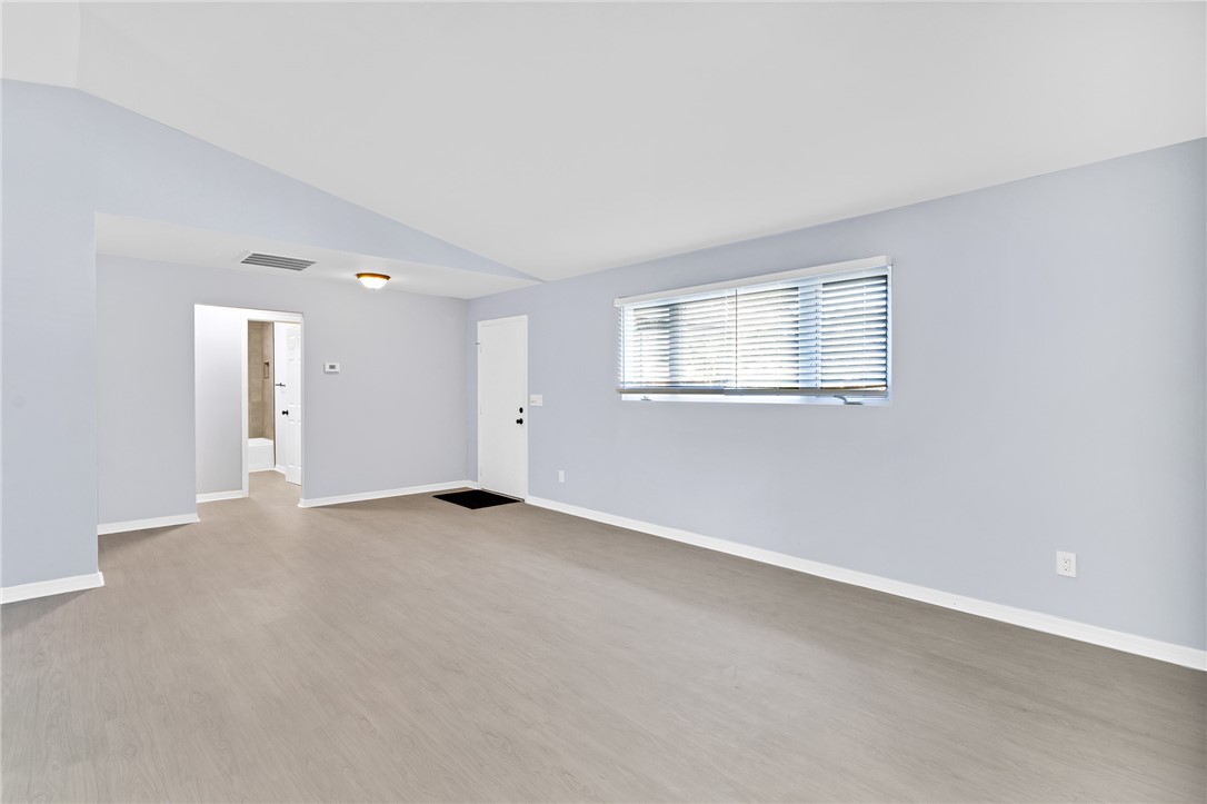 669 Vocelle Avenue Sebastian, FL 32958 - Photo 4 of 34 an empty room with windows