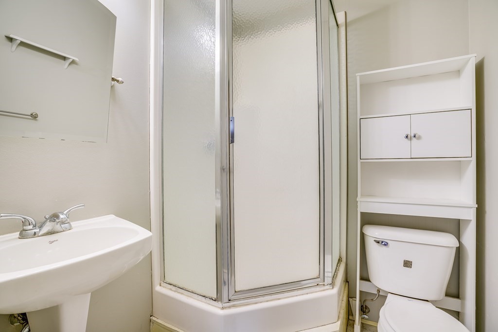 81 Burns Road Pelham, NH 03076 - Photo 34 of 39 a bathroom with a sink toilet and vanity