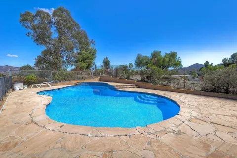 a view of outdoor space and swimming pool