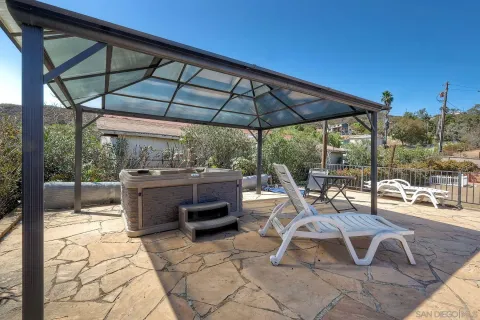a view of backyard with sitting area