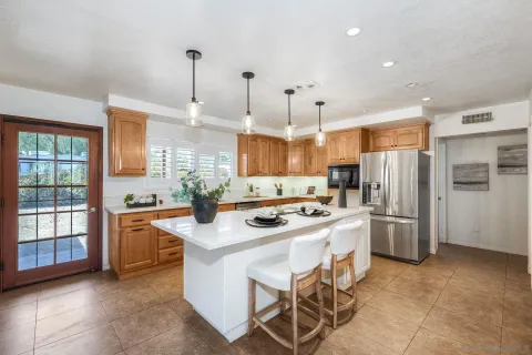 a kitchen with a sink stove and refrigerator