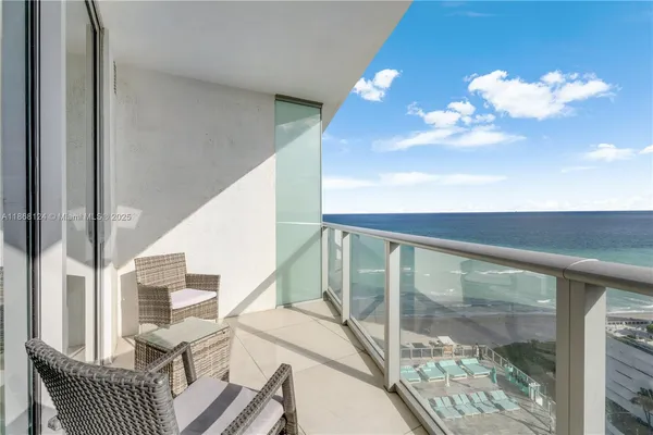 a view of a balcony with wooden floor