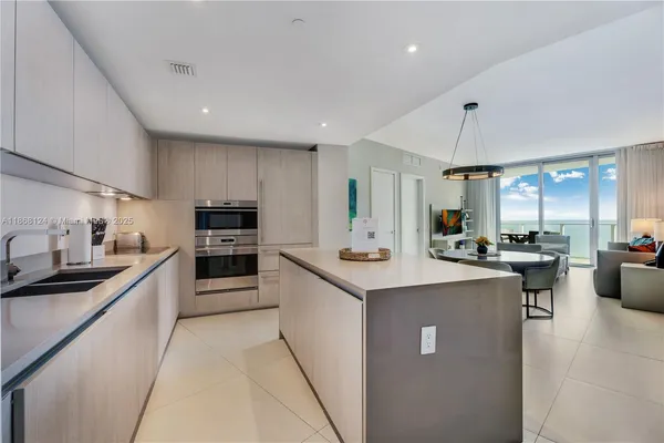 a kitchen with counter top space appliances and cabinets