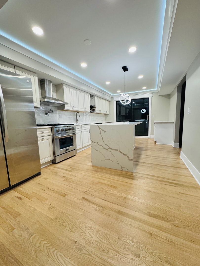 40 Portwine Road Willowbrook, IL 60527 - Photo 11 of 42 a large white kitchen with a stove a sink and a refrigerator