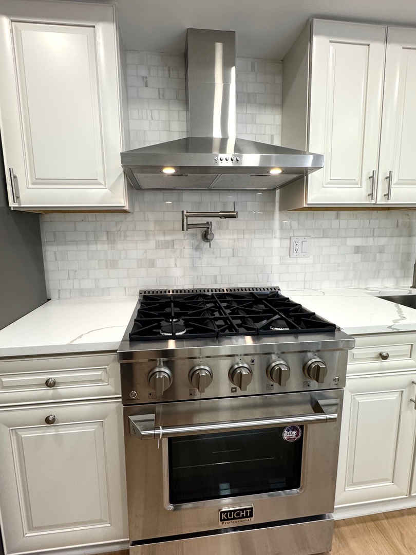 40 Portwine Road Willowbrook, IL 60527 - Photo 13 of 42 a stove top oven sitting inside of a kitchen